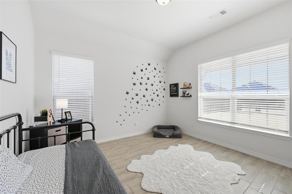 4425 Dandelion Lane Midlothian, TX 76065 - Photo 32 of 40 a bedroom with a bed and a window