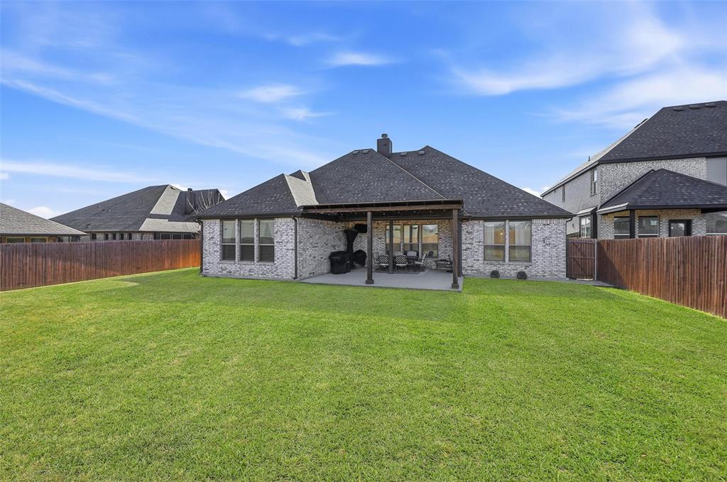 4425 Dandelion Lane Midlothian, TX 76065 - Photo 34 of 40 a front view of a house with a garden