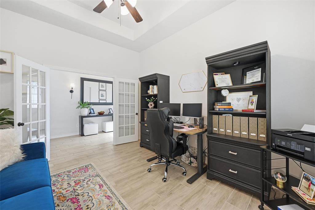 4425 Dandelion Lane Midlothian, TX 76065 - Photo 5 of 40 a view of a workspace with furniture and wooden floor