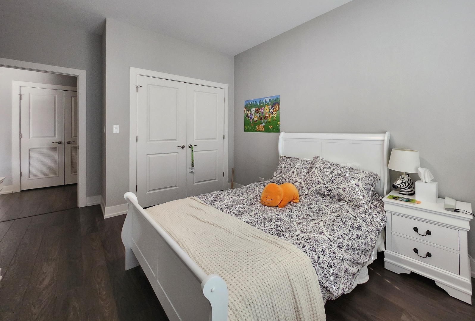 1202 Waukegan Road, Unit 201 Glenview, IL 60025 - Photo 13 of 15 a bedroom with a bed and wooden floor