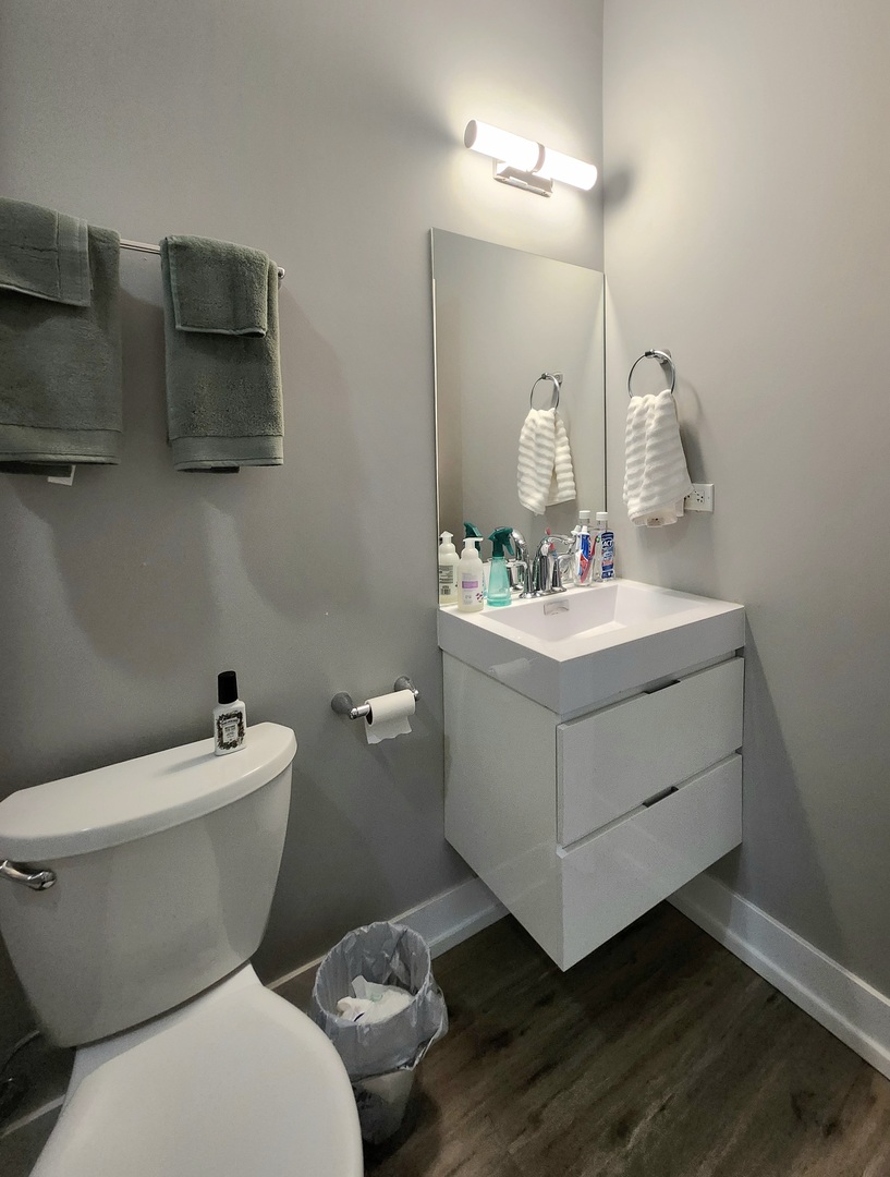 1202 Waukegan Road, Unit 201 Glenview, IL 60025 - Photo 15 of 15 a bathroom with a sink mirror and toilet