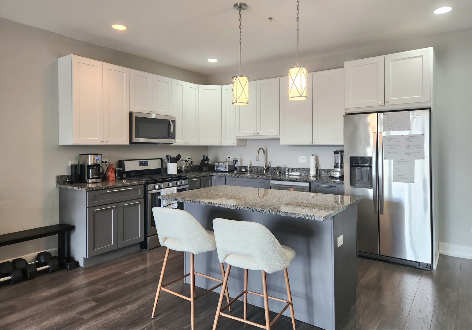 1202 Waukegan Road, Unit 201 Glenview, IL 60025 - Photo 2 of 15 a kitchen with kitchen island granite countertop a sink a center island and stainless steel appliances
