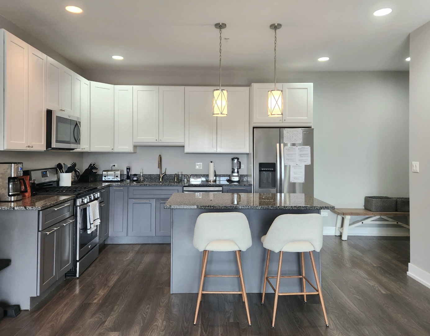 1202 Waukegan Road, Unit 201 Glenview, IL 60025 - Photo 3 of 15 a kitchen with a dining table chairs stainless steel appliances and cabinets