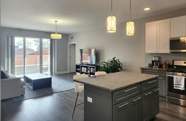 a kitchen with a stove a sink and a refrigerator
