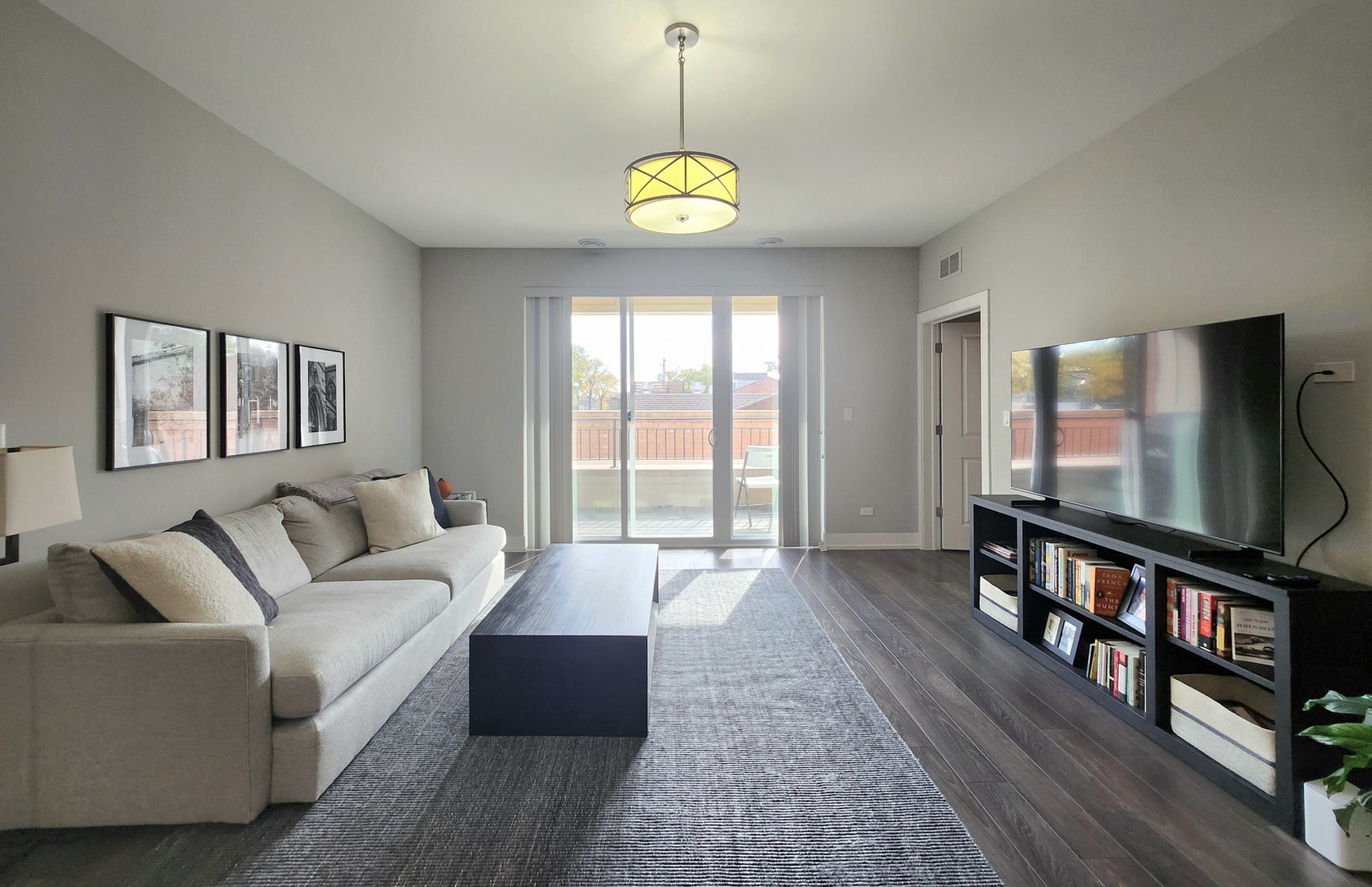 1202 Waukegan Road, Unit 201 Glenview, IL 60025 - Photo 5 of 15 a living room with furniture a window and a flat screen tv
