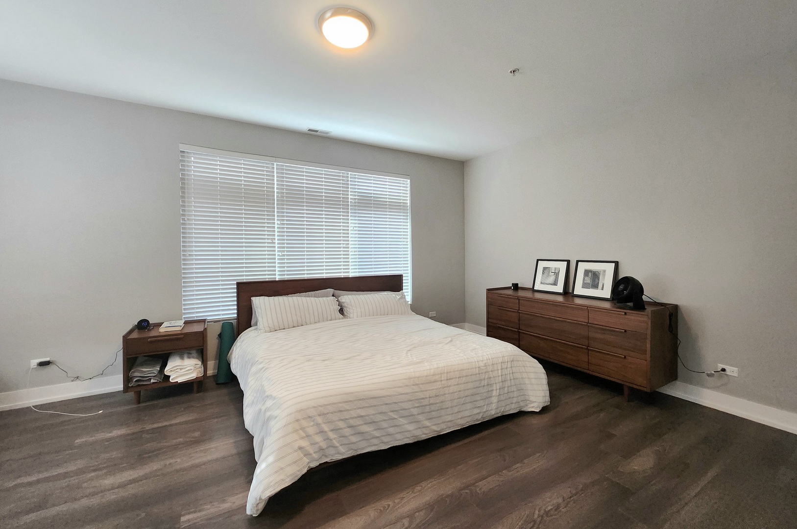 1202 Waukegan Road, Unit 201 Glenview, IL 60025 - Photo 8 of 15 a bedroom with a bed and a window