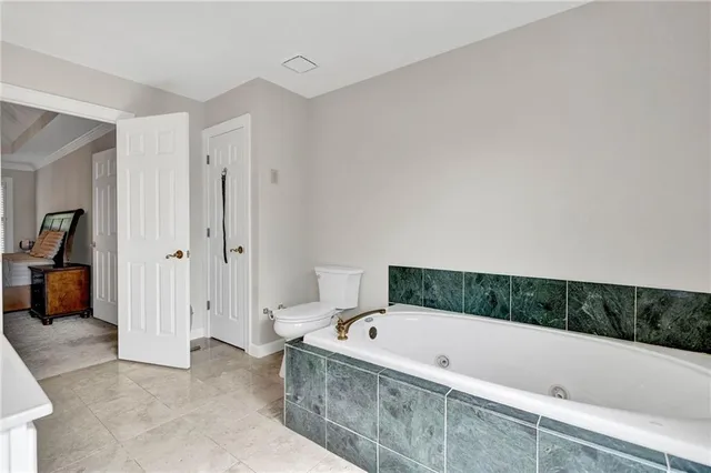 a bathroom with a shower sink and mirror