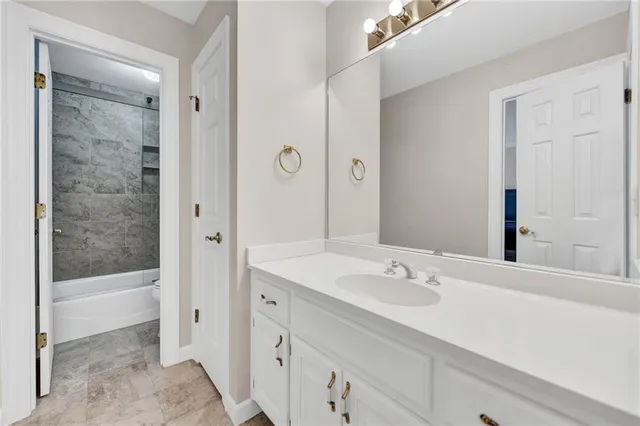 a spacious bedroom with a bed and a table in it