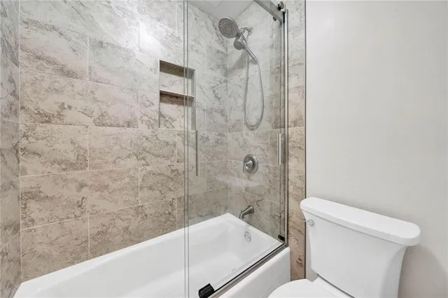 a bedroom with a bed and a chair