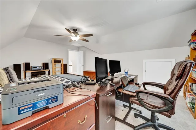 a living room with furniture and stairs