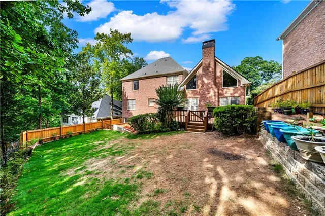 a view of a house with a back yard