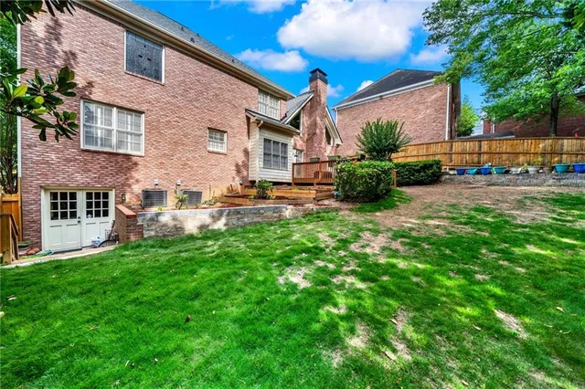 a view of balcony with wooden floor and outdoor seating