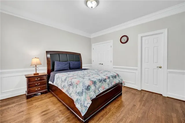 a bedroom with a bed and a lamp