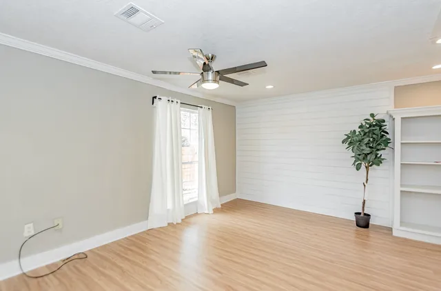 a kitchen with a sink a stove a refrigerator and cabinets