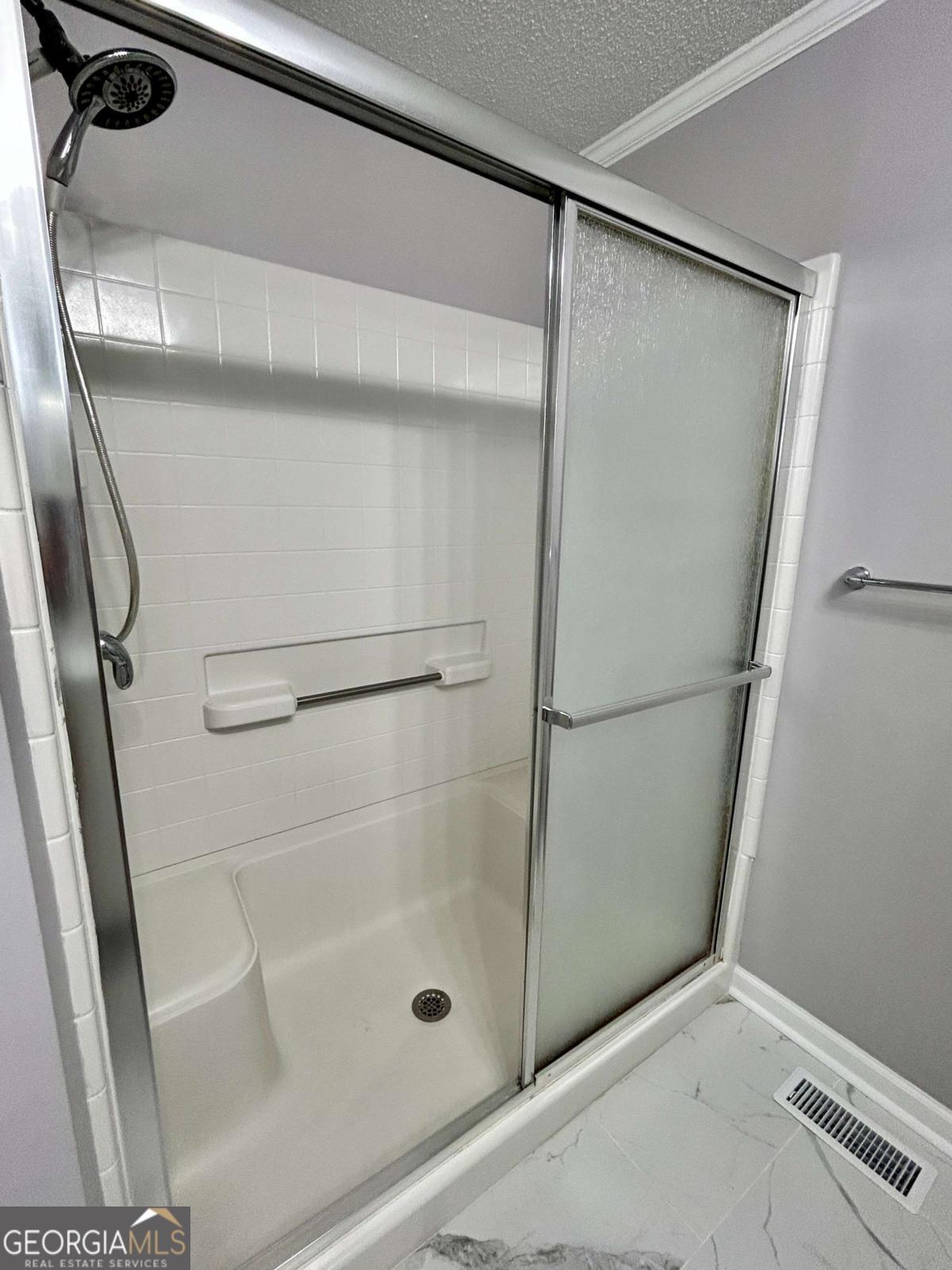 1430 Madison Avenue Tifton, GA 31794 - Photo 14 of 27 a bathroom with a glass shower door