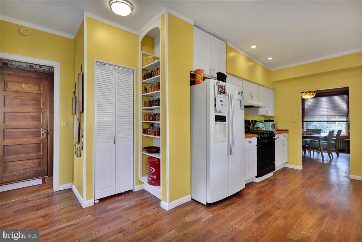 207 State Street Reading, PA 19607 - Photo 19 of 55 a kitchen with stainless steel appliances granite countertop a refrigerator and a stove top oven