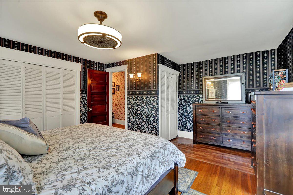 207 State Street Reading, PA 19607 - Photo 23 of 55 a bedroom with a large bed and a dresser