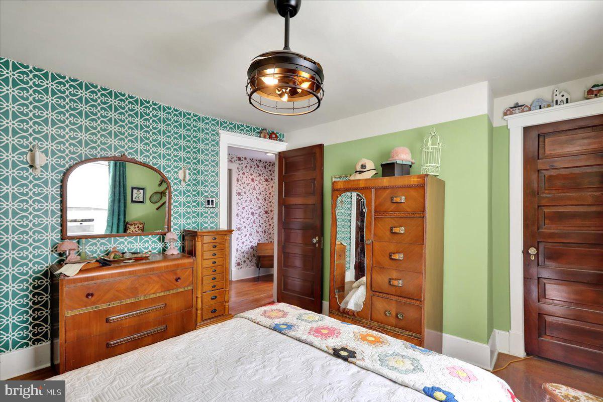 207 State Street Reading, PA 19607 - Photo 25 of 55 a bedroom with a bed and a dresser