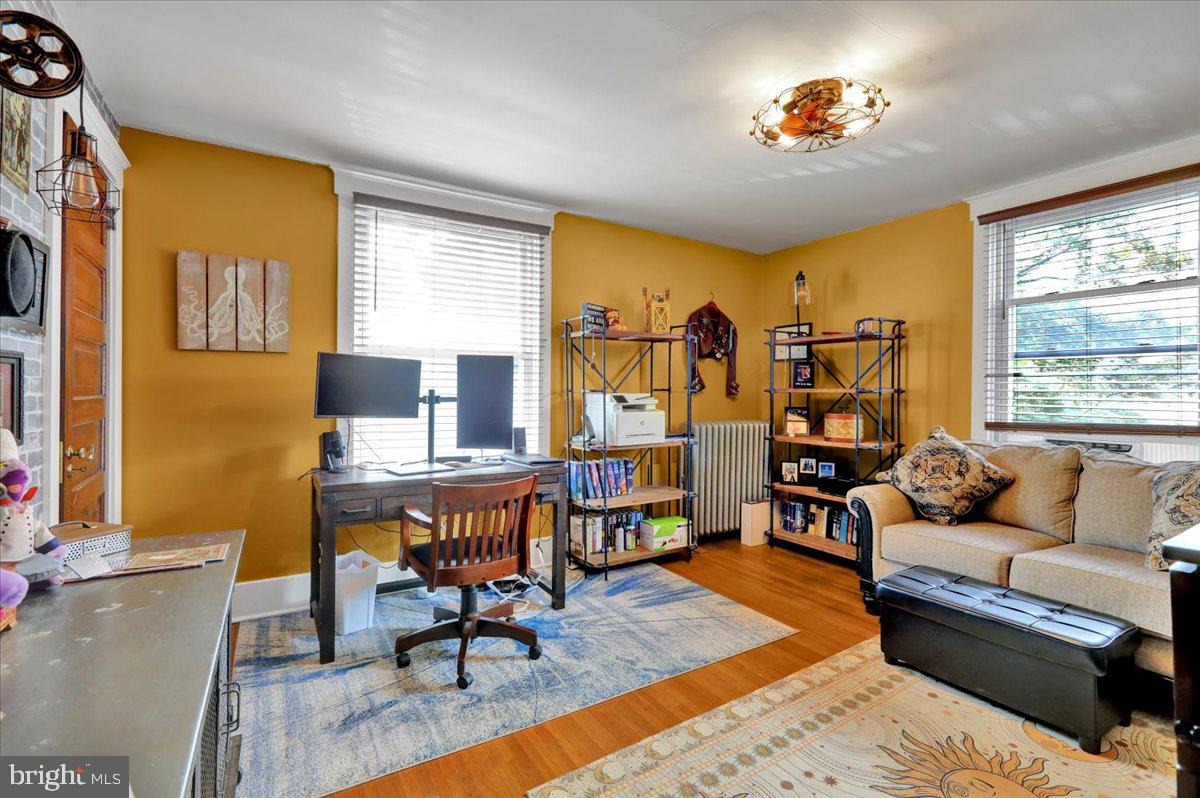207 State Street Reading, PA 19607 - Photo 26 of 55 a living room with furniture and a flat screen tv