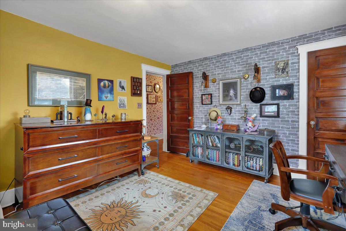 207 State Street Reading, PA 19607 - Photo 27 of 55 a bedroom with furniture and a wooden floor