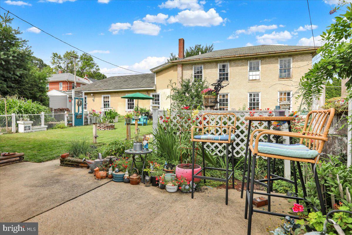 207 State Street Reading, PA 19607 - Photo 41 of 55 a view of a chair and table in backyard of the house