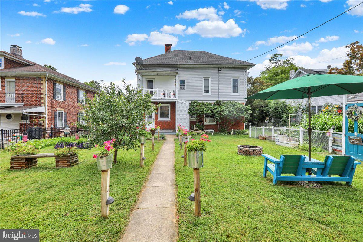 207 State Street Reading, PA 19607 - Photo 47 of 55 a view of a house with backyard sitting area and garden