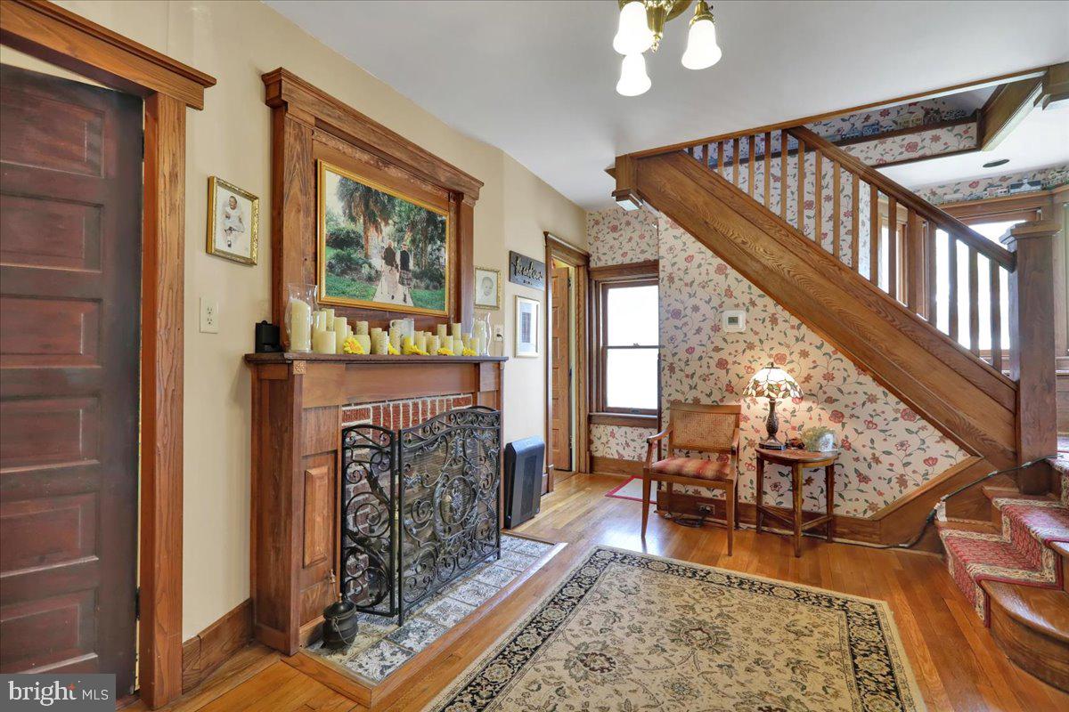 207 State Street Reading, PA 19607 - Photo 9 of 55 a living room with furniture and a fireplace