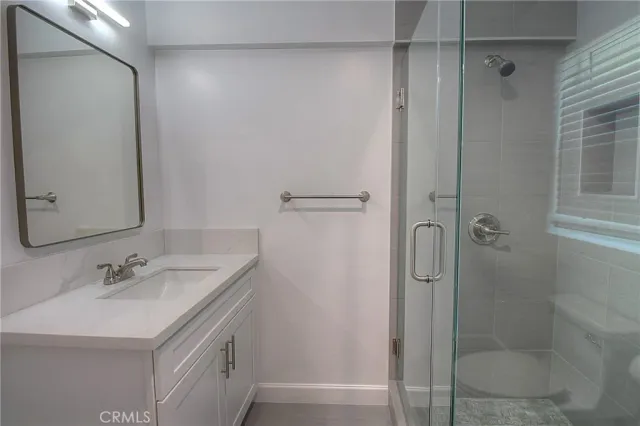 a bathroom with a sink and shower