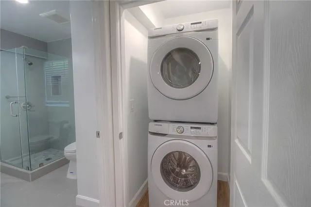 a view of a hallway with washer and dryer