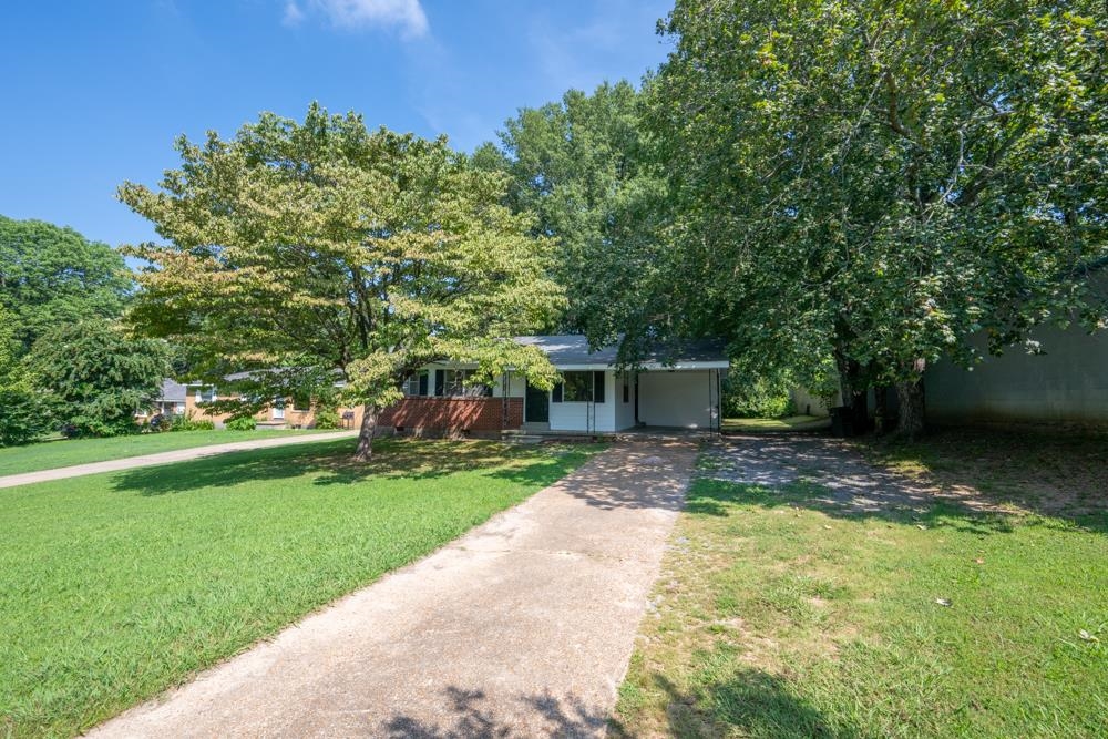 211 Drake Avenue Ripley, TN 38063 - Photo 1 of 25 a view of a house with backyard and garden