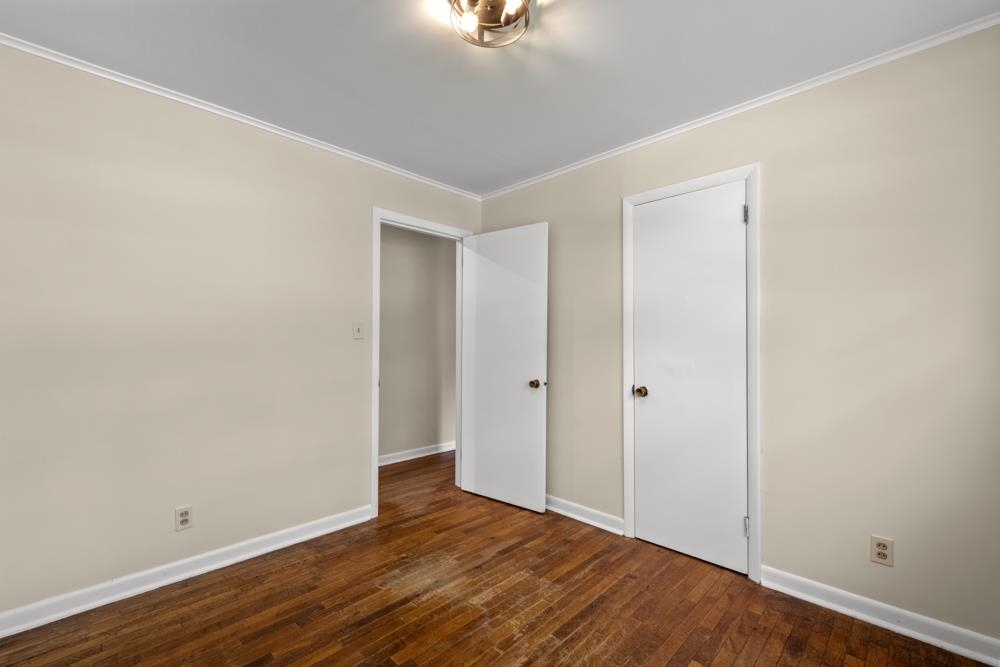 211 Drake Avenue Ripley, TN 38063 - Photo 17 of 25 a view of an empty room with wooden floor