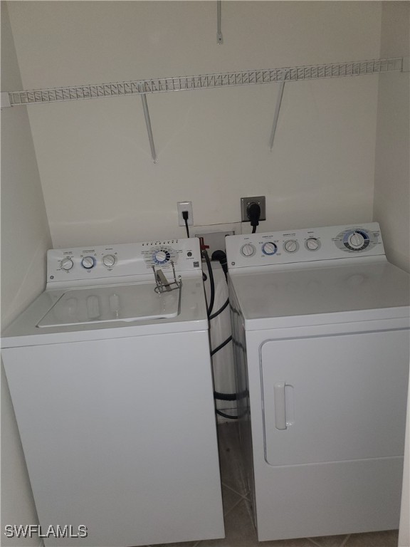 8490 Kingbird Loop, Unit 942 Estero, FL 33967 - Photo 11 of 11 a utility room with dryer and washer