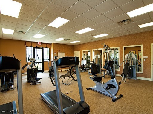 8490 Kingbird Loop, Unit 942 Estero, FL 33967 - Photo 4 of 11 a view of a room with gym equipment