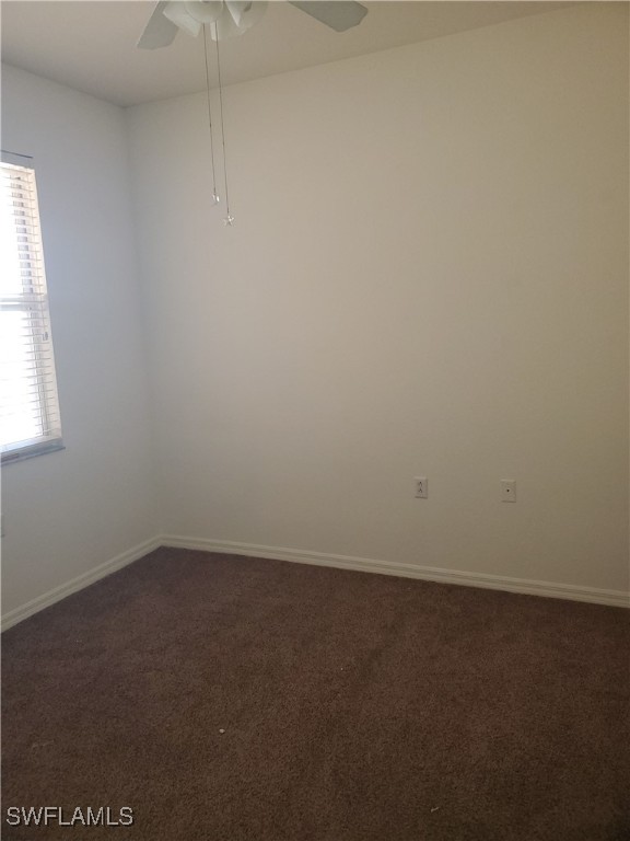 8490 Kingbird Loop, Unit 942 Estero, FL 33967 - Photo 6 of 11 an empty room with a window