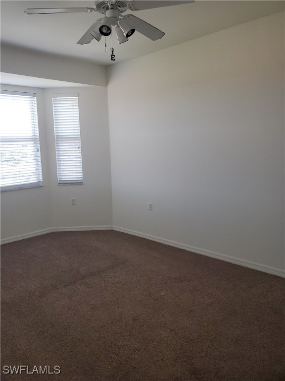 8490 Kingbird Loop, Unit 942 Estero, FL 33967 - Photo 7 of 11 an empty room with a window