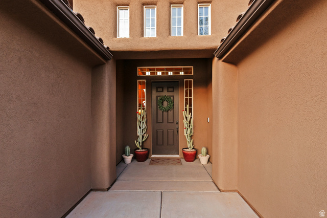 210 Talon Court Ivins, UT 84738 - Photo 6 of 60 View of exterior entry with stucco siding