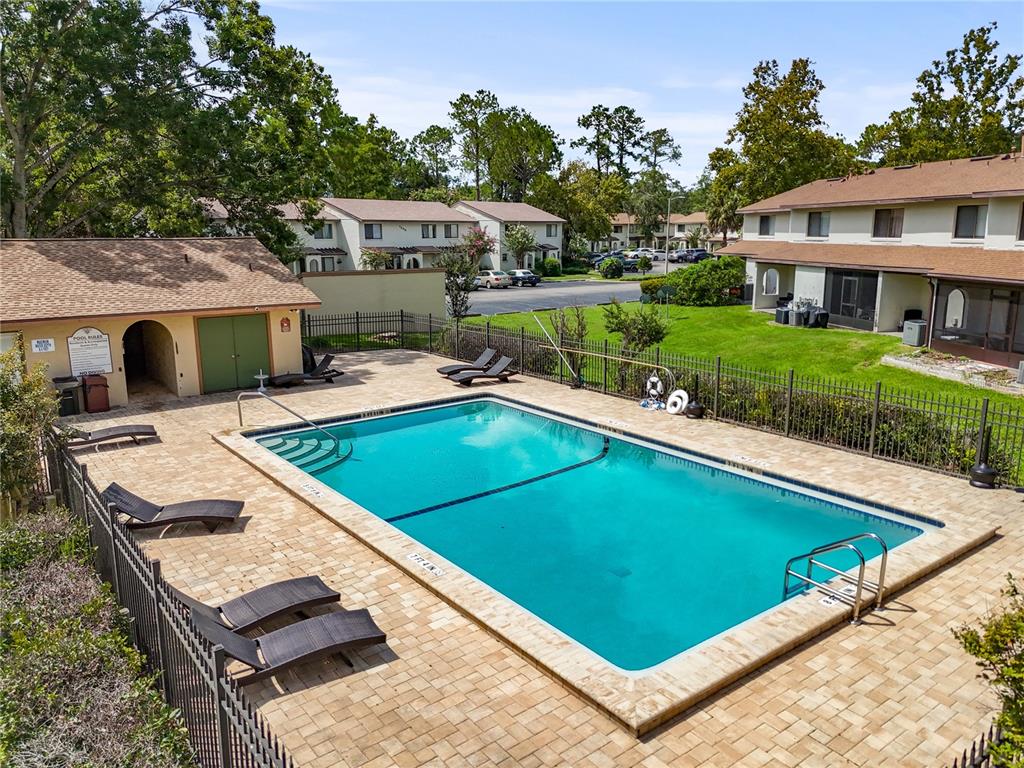 2635 Southwest 35th Place, Unit 705 Gainesville, FL 32608 - Photo 19 of 23 a view of a house with pool