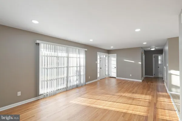 a view of a room with large windows