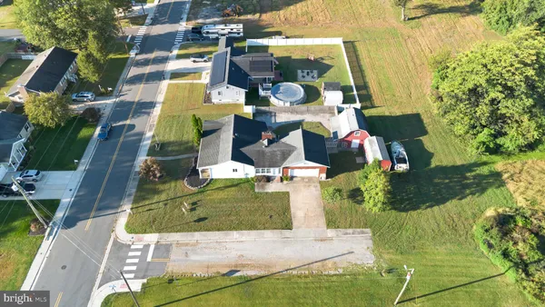 an aerial view of a residential apartment building with a yard