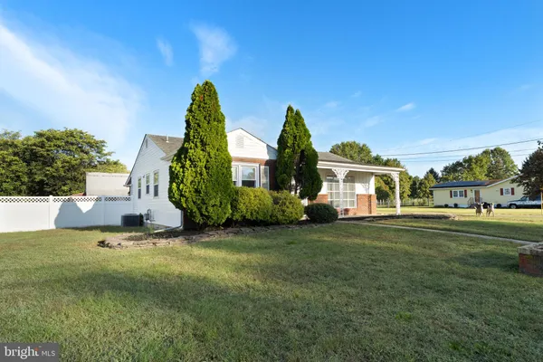 a view of a house with a big yard