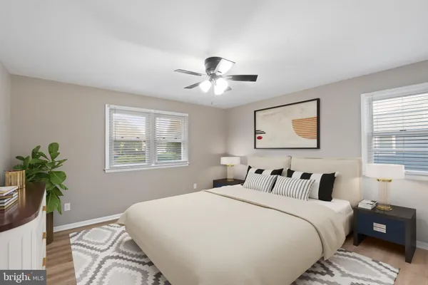 a bedroom with bed and a window