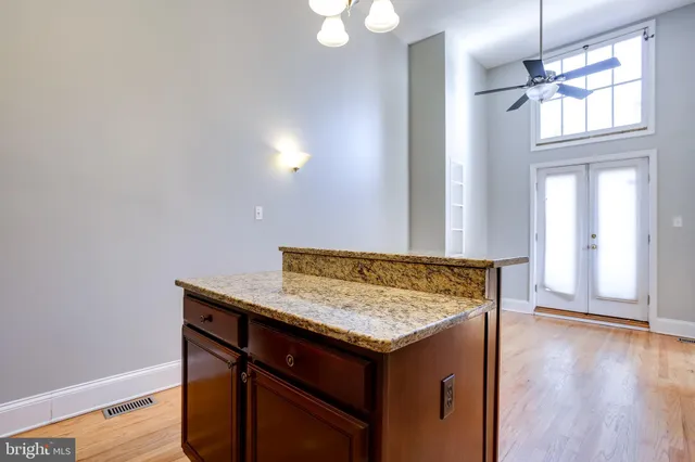 a view of a kitchen cabinets and wooden floor