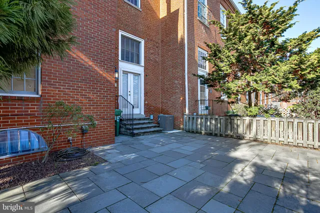 a view of a house with wooden fence