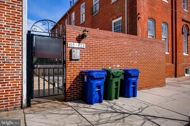 a view of a brick building with many windows