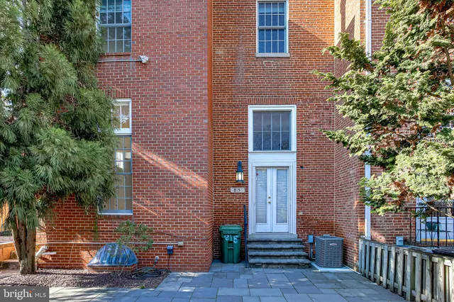 a front view of a house with stairs
