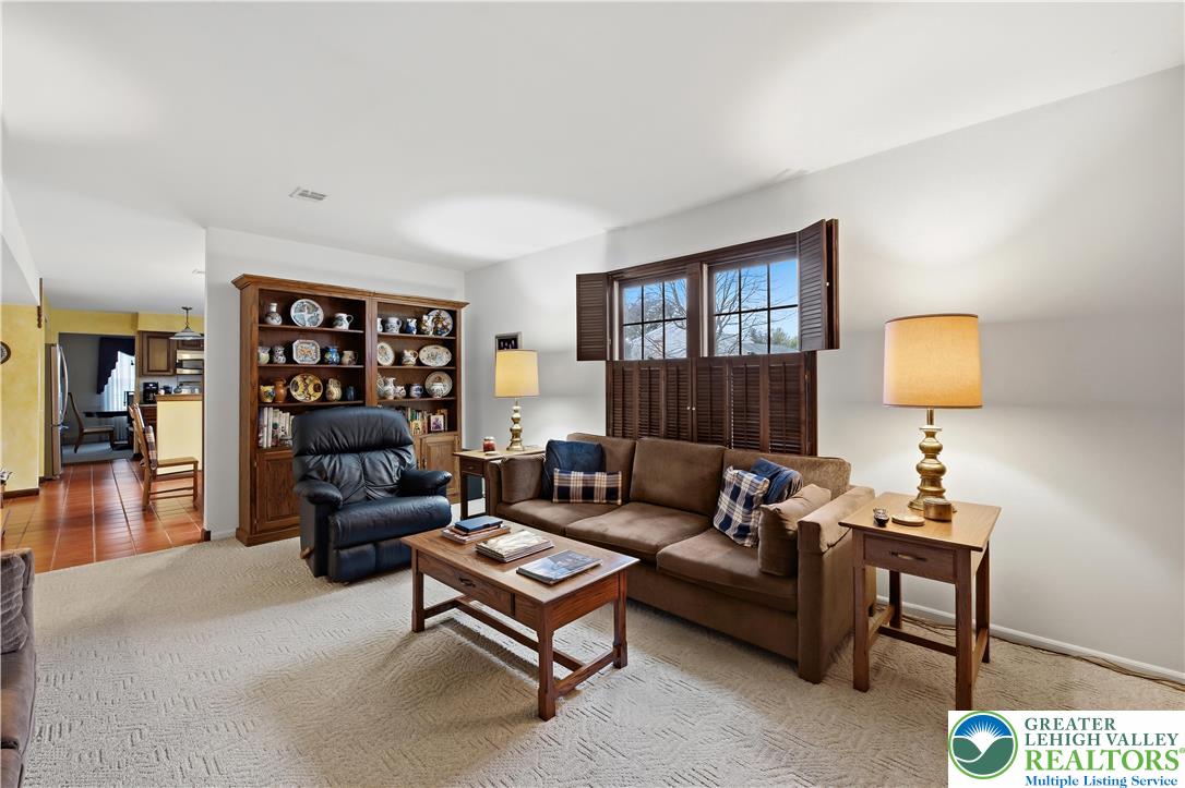 1700 Brandywine Road Allentown, PA 18104 - Photo 18 of 48 a living room with furniture a lamp and a window