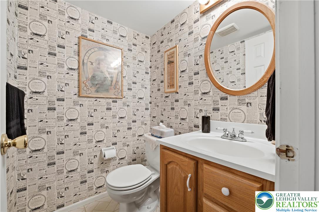 1700 Brandywine Road Allentown, PA 18104 - Photo 20 of 48 a bathroom with a toilet a sink and a mirror