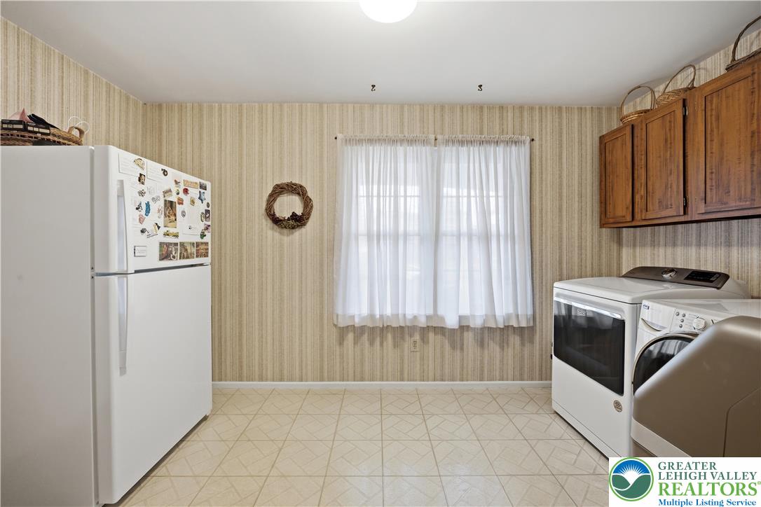 1700 Brandywine Road Allentown, PA 18104 - Photo 22 of 48 a kitchen with granite countertop a refrigerator a stove a sink and dishwasher
