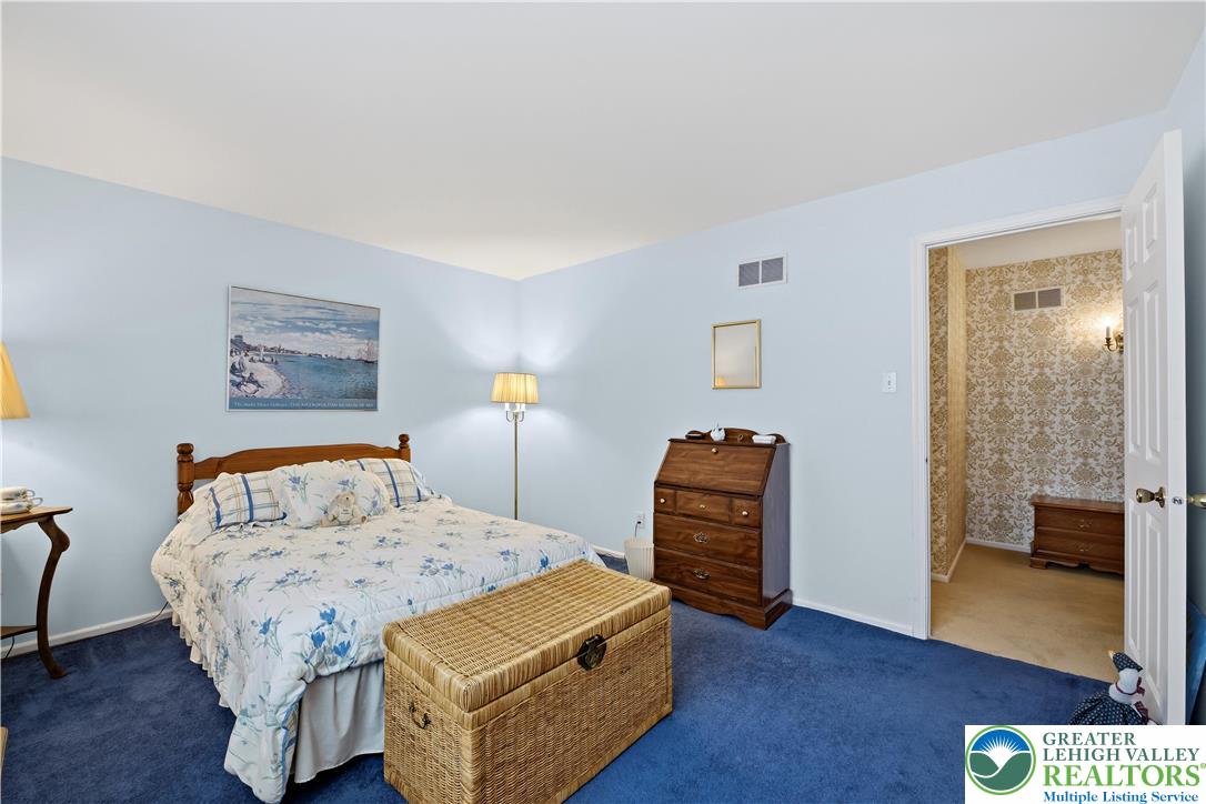 1700 Brandywine Road Allentown, PA 18104 - Photo 33 of 48 a bedroom with a bed and a lamp on table