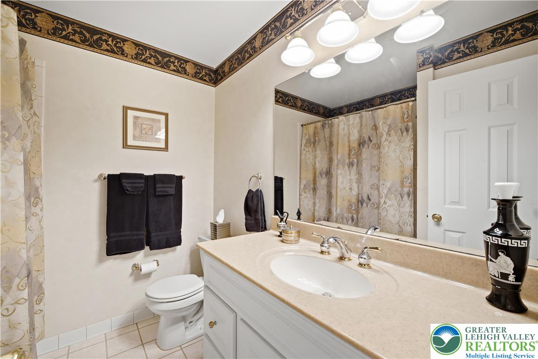 1700 Brandywine Road Allentown, PA 18104 - Photo 38 of 48 a bathroom with a toilet sink and mirror